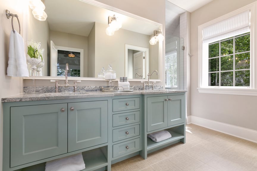 Beautiful bathroom with mint green cabinets